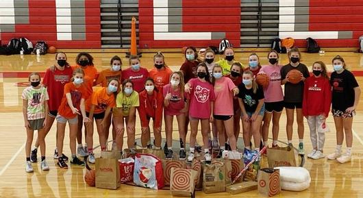 Girls'  Varsity and JV Basketball Team donate to the Christmas Bureau